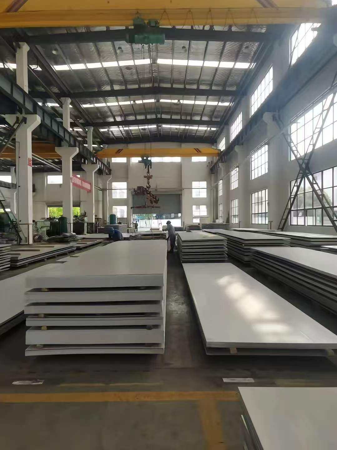 Stainless steel plate stock in a factory storage area
