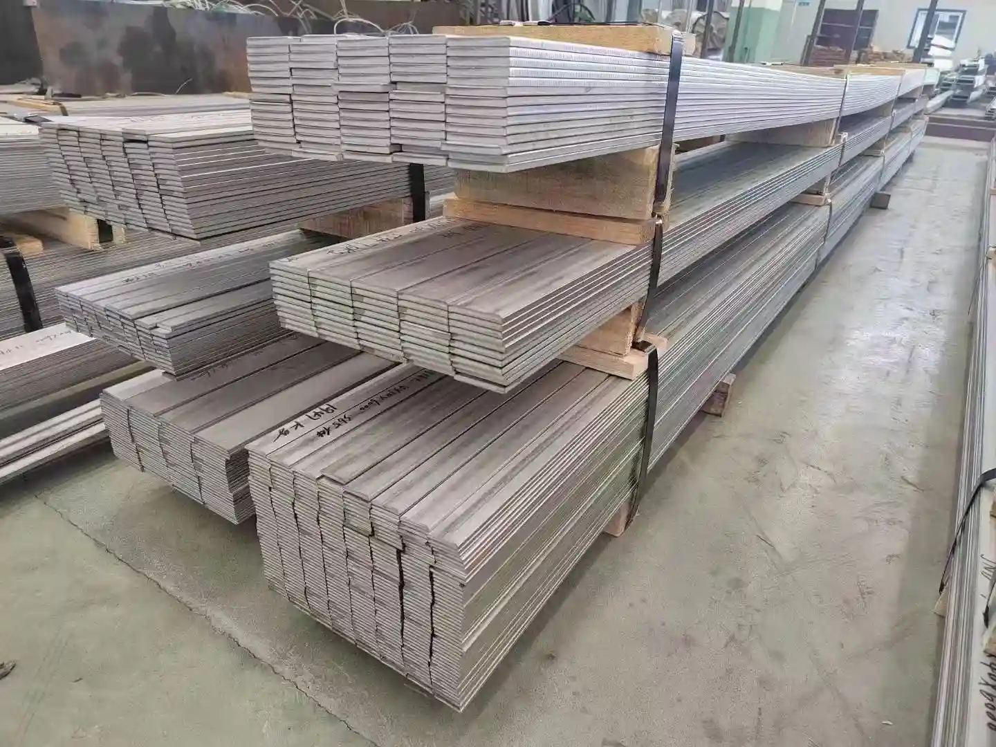 Stainless steel flat bars stacked for industrial supply